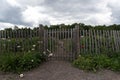 Beautiful round rail fencing flower garden in the cloudy day.