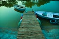 Wooden row boat . green shade. boat dock and wooden boat Royalty Free Stock Photo