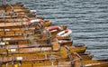 Wooden rowing boats moored up against a jetty in the Cotswolds Royalty Free Stock Photo