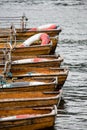 Wooden rowing boats moored up against a jetty in the Cotswolds Royalty Free Stock Photo