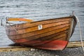 Wooden rowing boats moored up against a jetty in the Cotswolds Royalty Free Stock Photo