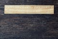 Wooden rulers in centimeter and inch on old wood rustic background nature eco environment concept idea Royalty Free Stock Photo