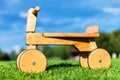 Wooden runbike on the grass field outdoors Royalty Free Stock Photo