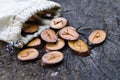 Wooden runes in a bag on an old stump