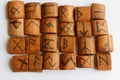 Wooden runes lie on a table on a white background Royalty Free Stock Photo
