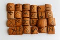 Wooden runes lie on a table on a white background Royalty Free Stock Photo