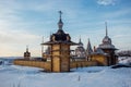 Wooden Russian church courtyard in sunny winter day Royalty Free Stock Photo