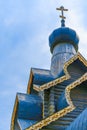 Wooden Russian Orthodox Church against the background of blue sky and clouds Royalty Free Stock Photo