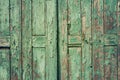 Wooden rustic background with old green planks. Vintage door detail Royalty Free Stock Photo
