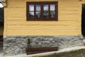 Wooden, rustic window in old cottage, Vlkolinec, Slovakia Royalty Free Stock Photo