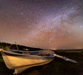 Wooden rusty boat under stars