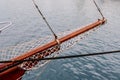 Wooden sailboat on the blue mediterranean sea Details of a classic beautiful sailing yacht with ropes knots and wood plank on deck Royalty Free Stock Photo