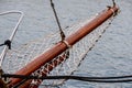 Wooden sailboat on the blue mediterranean sea Details of a classic beautiful sailing yacht with ropes knots and wood plank on deck Royalty Free Stock Photo