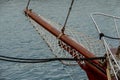 Wooden sailboat on the blue mediterranean sea Details of a classic beautiful sailing yacht with ropes knots and wood plank on deck Royalty Free Stock Photo