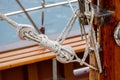 Wooden sailboat on the blue mediterranean sea Details of a classic beautiful sailing yacht with ropes knots and wood plank on deck Royalty Free Stock Photo