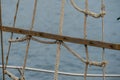 Wooden sailboat on the blue mediterranean sea Details of a classic beautiful sailing yacht with ropes knots and wood plank on deck Royalty Free Stock Photo