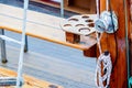 Wooden sailboat on the blue mediterranean sea Details of a classic beautiful sailing yacht with ropes knots and wood Royalty Free Stock Photo