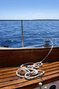 Wooden sailboat boat deck blue sky ocean sea Royalty Free Stock Photo