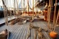 wooden sailboat deck with ropes, pulleys, and rigging Royalty Free Stock Photo