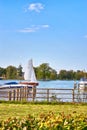 Wooden sailboat on Lake Schwerin with a view of the city