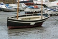 Wooden sailing boat beached in the harbour