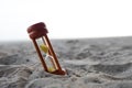 Wooden sand clock put on beach background