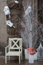 Wooden santa chair near white trees and boxes with presents