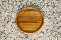 Wooden saucer on granite stone Royalty Free Stock Photo