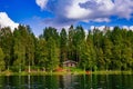 Wooden sauna log cabin at the lake in summer in Finland Royalty Free Stock Photo
