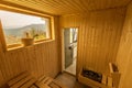 Wooden sauna with seats. Accessories interior of sauna spa Royalty Free Stock Photo