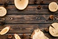 Wooden sawcut and pine cone frame for blog on rustic background top view mockup Royalty Free Stock Photo