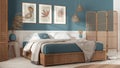 Wooden scandinavian bedroom in white and blue tones. Double bed with blankets. Wall panel and parquet floor, carpet.Rattan folding