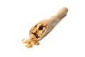 Wooden scoop with granola on white background