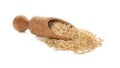 Wooden scoop with raw brown rice on white background Royalty Free Stock Photo