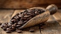 Wooden scoop spilling roasted coffee beans on table Royalty Free Stock Photo