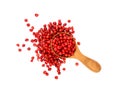 Wooden scoop spoon full of pink peppercorns Royalty Free Stock Photo