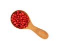 Wooden scoop spoon full of pink peppercorns Royalty Free Stock Photo