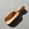 From light colored wood the scoop features a smoothly curved handle Royalty Free Stock Photo