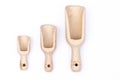 Wooden scoops, small, medium and large, as dosage, isolated