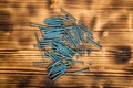 Wooden screws on burnt wooden desk Royalty Free Stock Photo