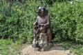 Wooden sculpture of a bear in the arboretum garden Royalty Free Stock Photo