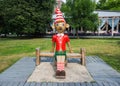 Wooden sculpture of Buratino (Russian Pinocchio) in the park Royalty Free Stock Photo