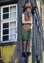 Wooden sculpture at facade of a house in Colmar