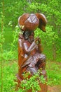 Wooden sculpture of musician in Dendrology garden in Pereslavl-Zalessky city