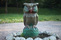 Wooden sculpture of owl , handcrafted for kids in a park