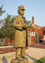 Wooden sculpture of 1890s-like railroad worker by chainsaw artist Clayton Coss at Norman Depot in Norman, Oklahoma.