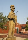 Wooden sculpture of 1890s-like railroad worker by chainsaw artist Clayton Coss at Norman Depot in Norman, Oklahoma.