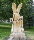 Wooden sculpture `Two Angels`. Strukovsky garden. Samara city. Royalty Free Stock Photo