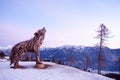 Wooden sculpture of a wolf. Italian landmark at dawn