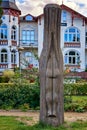 Wooden sculpture woman butt on the beach promenade Zinnowitz on the island Usedom